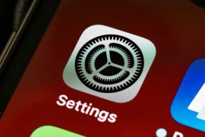 Detailed view of the iPhone screen showing the settings app icon.